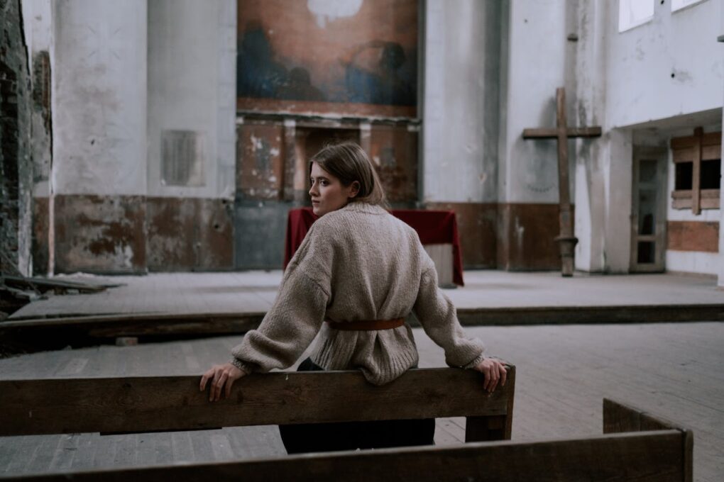 Woman in abandoned church - Photo by cottonbro studio