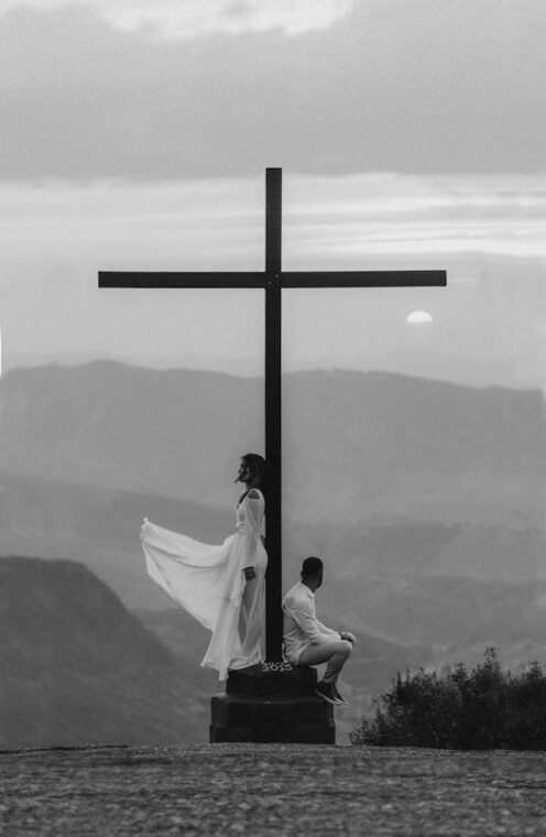 Photo by Jonathan Borba: https://www.pexels.com/photo/man-and-woman-pose-on-a-cross-monument-2917381/